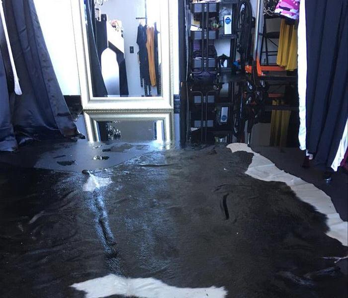 Water standing on the floors of this clothing store