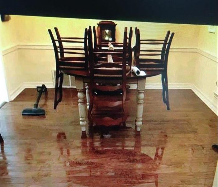 Picture of dinning room wood floor with water on it